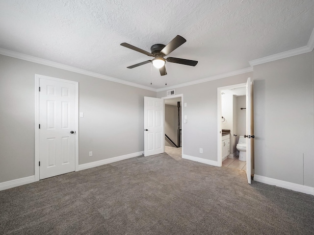 6402 Del Monte Dr Unit 20, Houston, TX 77057 - unfurnished bedroom with crown molding, light colored carpet, a textured ceiling, baseboards, and ensuite bathroom