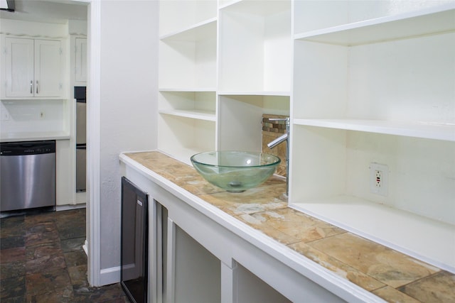 912 Robinson Rd, La Porte, TX 77571 - interior space with dishwasher and dark stone finish floors