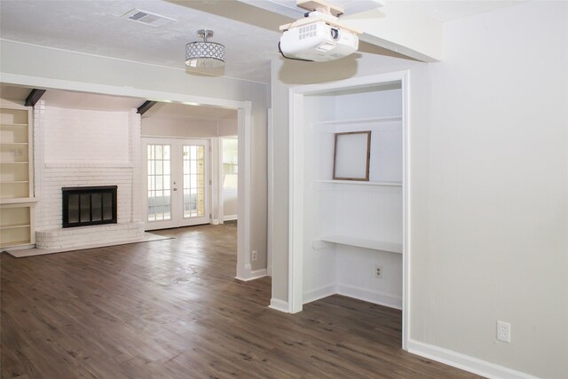 912 Robinson Rd, La Porte, TX 77571 - unfurnished living room with baseboards, dark wood-style floors, and a fireplace