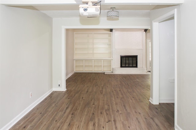 912 Robinson Rd, La Porte, TX 77571 - unfurnished living room with wood finished floors, baseboards, and a fireplace