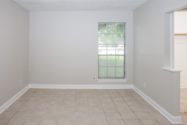 912 Robinson Rd, La Porte, TX 77571 - empty room featuring baseboards and light tile patterned floors
