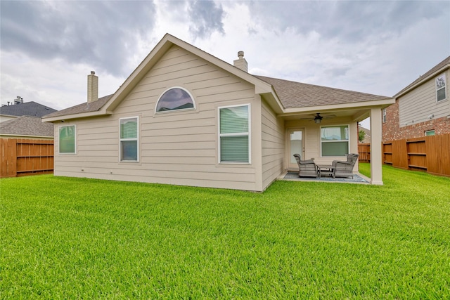 22210 Pacific Ocean Dr, Spring, TX 77388 - rear view of house featuring a ceiling fan, a chimney, a patio area, an outdoor living space, and roof with shingles