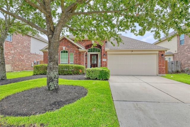 22210 Pacific Ocean Dr, Spring, TX 77388 - traditional-style home with brick siding, a garage, a shingled roof, and driveway