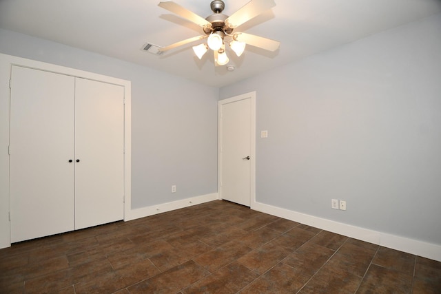 8642 Meadowcroft Dr, Houston, TX 77063 - unfurnished bedroom featuring a closet, ceiling fan, and baseboards