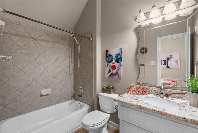 2512 Garnetfield Ln, Friendswood, TX 77546 - full bathroom with vanity, toilet, bathing tub / shower combination, and lofted ceiling