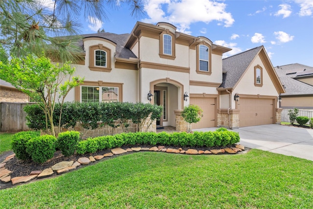 315 Lagarto Way, Pinehurst, TX 77362 - view of front of house featuring stucco siding, driveway, stone siding, and roof with shingles