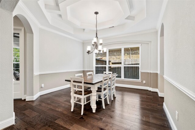 315 Lagarto Way, Pinehurst, TX 77362 - dining room featuring a chandelier, arched walkways, dark wood-style floors, ornamental molding, and baseboards