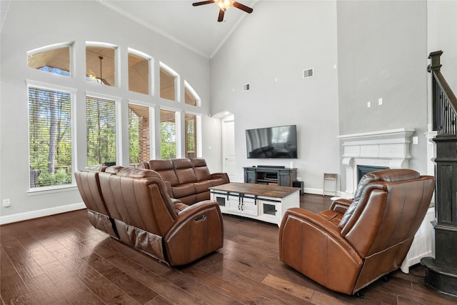 315 Lagarto Way, Pinehurst, TX 77362 - living room with a fireplace, high vaulted ceiling, ceiling fan, baseboards, and dark wood-style flooring