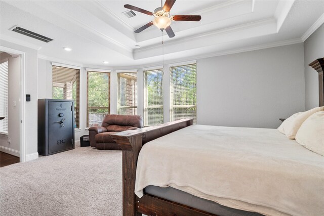 315 Lagarto Way, Pinehurst, TX 77362 - carpeted bedroom featuring crown molding, a raised ceiling, ceiling fan, and baseboards