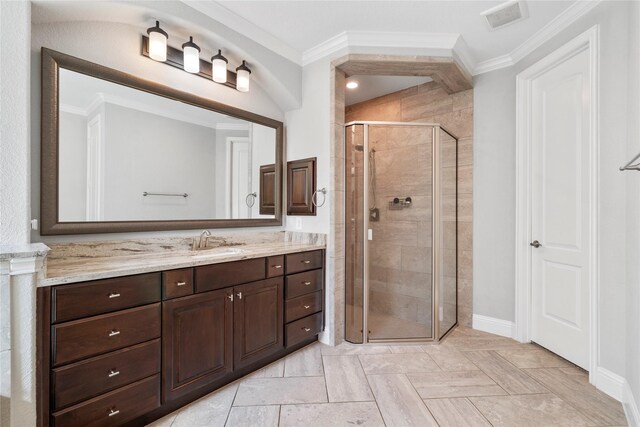 315 Lagarto Way, Pinehurst, TX 77362 - full bathroom with a stall shower, vanity, crown molding, and baseboards