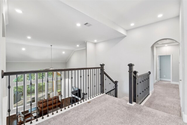 315 Lagarto Way, Pinehurst, TX 77362 - corridor with an upstairs landing, carpet flooring, arched walkways, recessed lighting, and baseboards