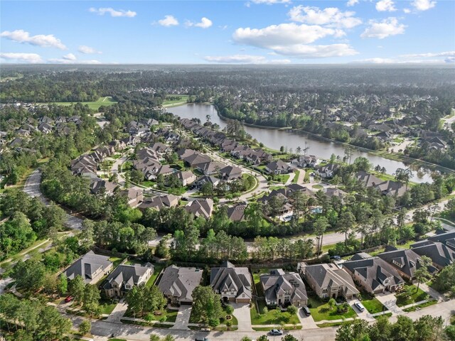 315 Lagarto Way, Pinehurst, TX 77362 - aerial view of property and surrounding area with nearby suburban area and a large body of water