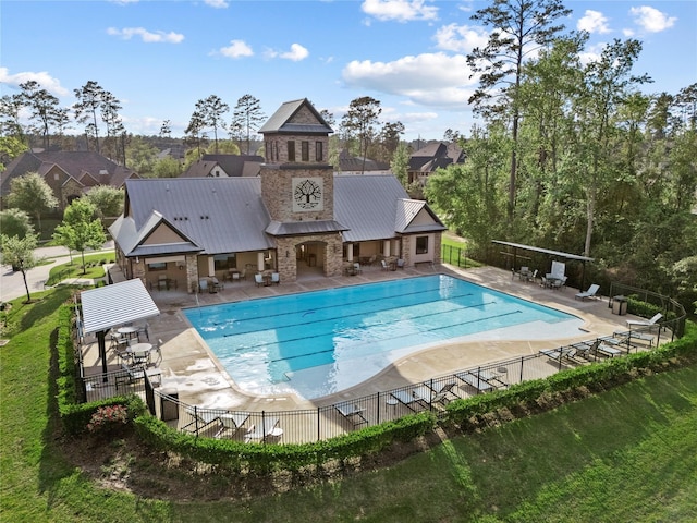 315 Lagarto Way, Pinehurst, TX 77362 - community pool featuring a patio