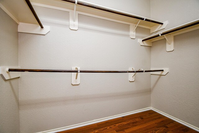 20722 Raven Mist Ct, Katy, TX 77449 - walk in closet featuring dark wood-style flooring