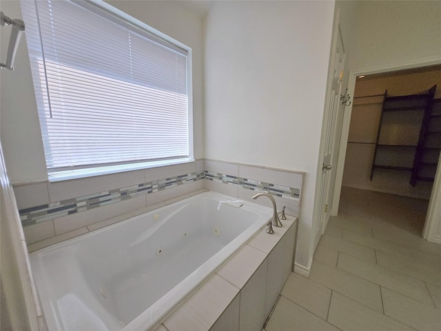 6415 Taimer Ct, Sugar Land, TX 77479 - bathroom featuring a whirlpool tub and tile patterned floors