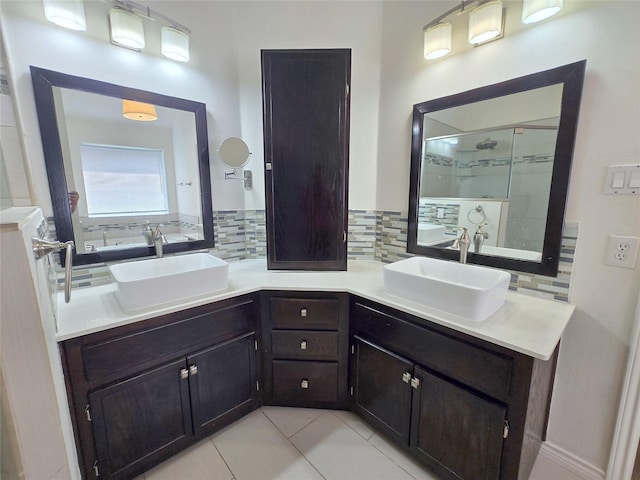 6415 Taimer Ct, Sugar Land, TX 77479 - bathroom featuring tasteful backsplash, double vanity, a tile shower, and tile patterned floors