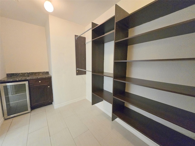 6415 Taimer Ct, Sugar Land, TX 77479 - spacious closet with wine cooler and light tile patterned floors