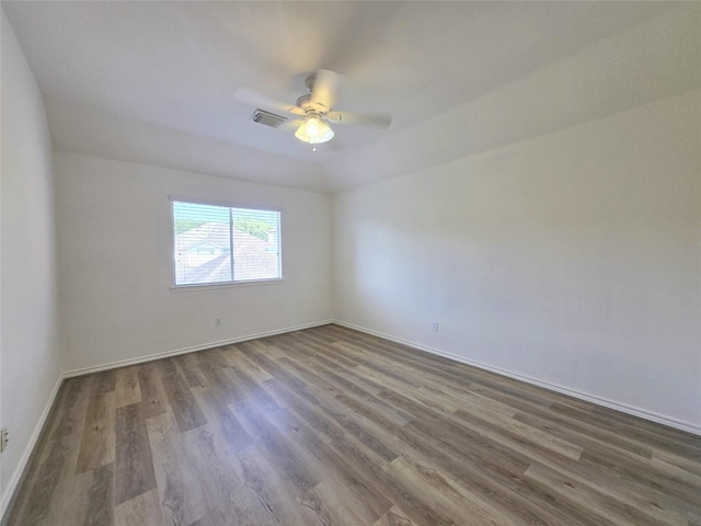 6415 Taimer Ct, Sugar Land, TX 77479 - spare room with dark wood-style flooring, baseboards, and a ceiling fan