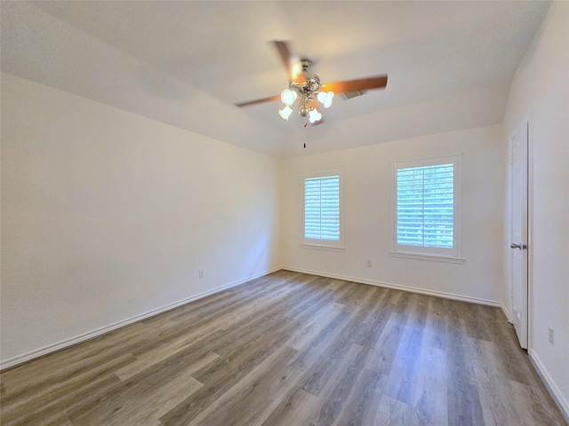 6415 Taimer Ct, Sugar Land, TX 77479 - empty room with a ceiling fan, wood finished floors, and baseboards