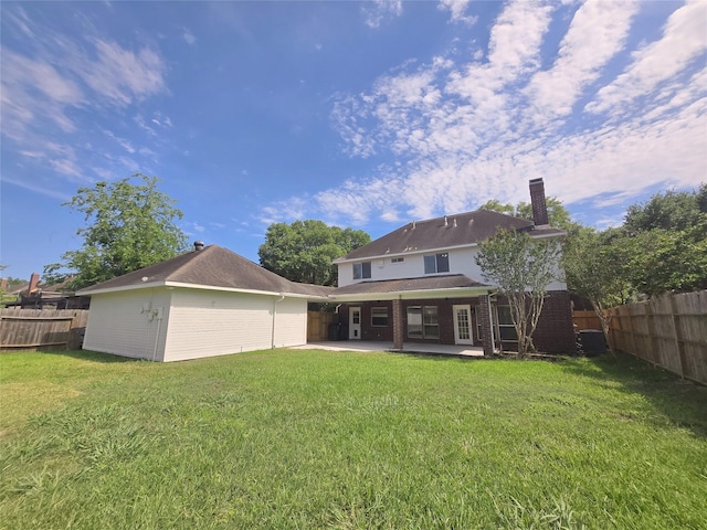 6415 Taimer Ct, Sugar Land, TX 77479 - back of house with a patio and a chimney