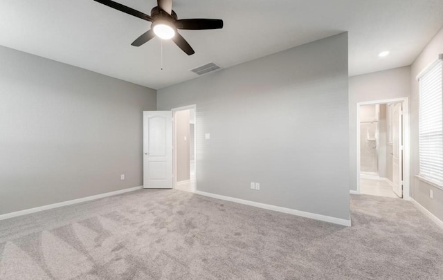 4827 Austin Meadow Ln, Katy, TX 77449 - unfurnished bedroom with carpet flooring, baseboards, ensuite bathroom, and a ceiling fan