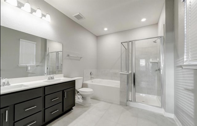 4827 Austin Meadow Ln, Katy, TX 77449 - bathroom featuring a bath, double vanity, a stall shower, toilet, and tile patterned floors