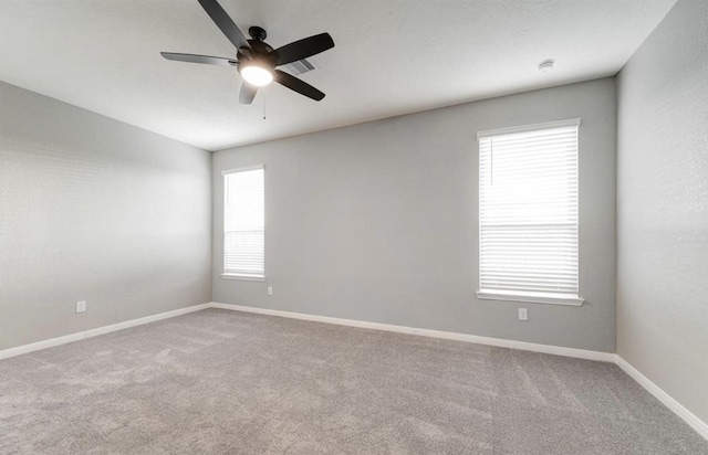 4827 Austin Meadow Ln, Katy, TX 77449 - spare room with ceiling fan, carpet flooring, baseboards, and a smoke detector