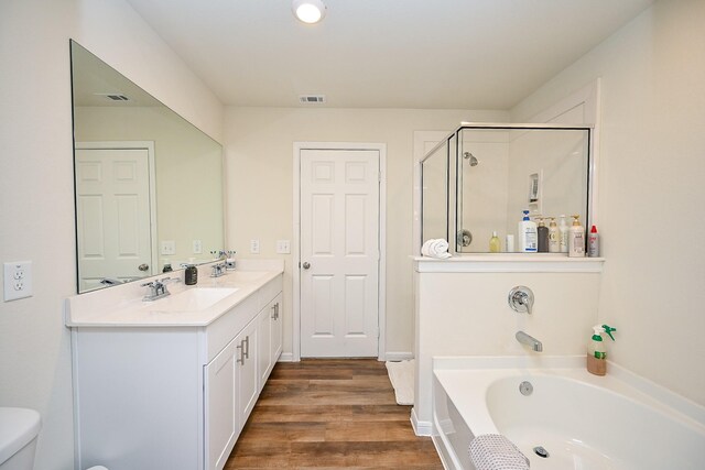 4611 Prairie Chase Dr, Houston, TX 77069 - full bath featuring a bath, double vanity, wood finished floors, a shower stall, and toilet