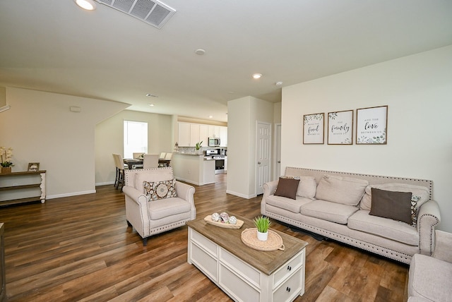 4611 Prairie Chase Dr, Houston, TX 77069 - living area with dark wood-type flooring, recessed lighting, and baseboards