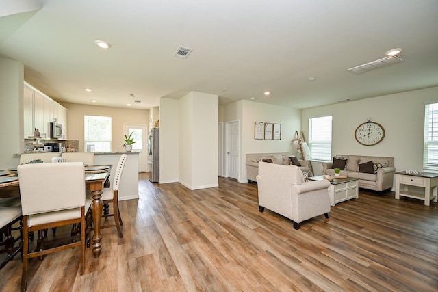 4611 Prairie Chase Dr, Houston, TX 77069 - living room with plenty of natural light, wood finished floors, recessed lighting, and baseboards