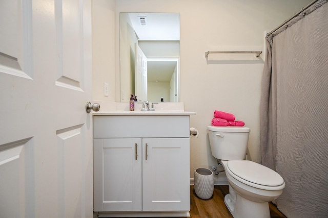 4611 Prairie Chase Dr, Houston, TX 77069 - full bathroom with toilet, vanity, wood finished floors, and a shower with curtain