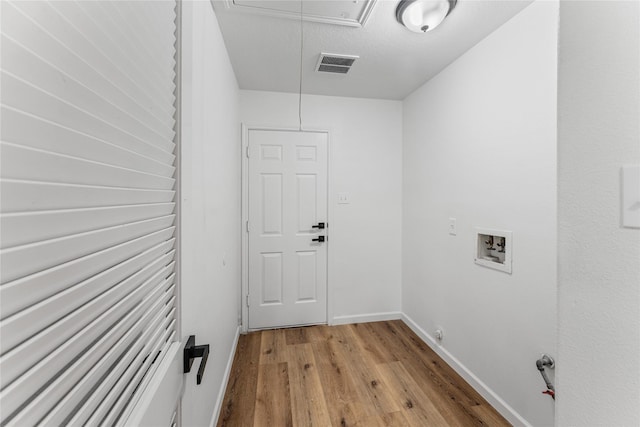 7815 Brook Trail Cir, Houston, TX 77040 - laundry room featuring attic access, washer hookup, light wood-type flooring, and baseboards