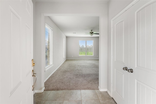 8014 Oxbow Manor Ln, Cypress, TX 77433 - corridor featuring light colored carpet, baseboards, and light tile patterned floors