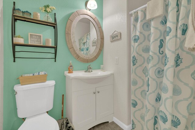 123 Howard Ave, Surfside Beach, TX 77541 - bathroom featuring vanity, toilet, and curtained shower