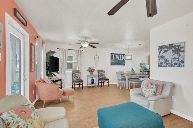 123 Howard Ave, Surfside Beach, TX 77541 - living area featuring ceiling fan, light wood finished floors, and baseboards