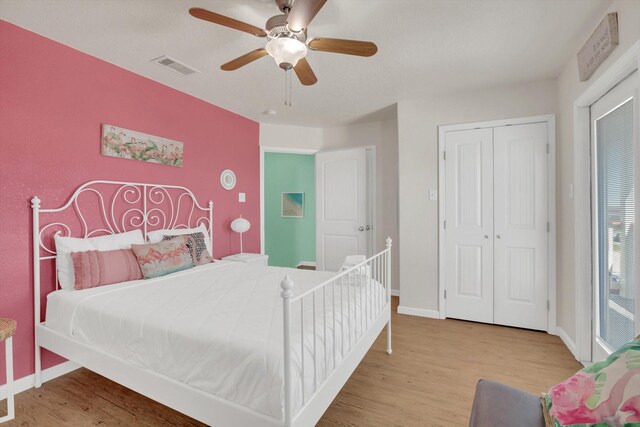 123 Howard Ave, Surfside Beach, TX 77541 - bedroom featuring wood finished floors, a closet, baseboards, and a ceiling fan