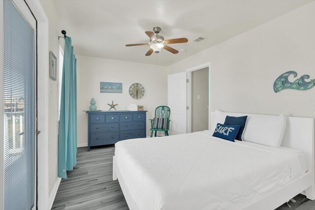 123 Howard Ave, Surfside Beach, TX 77541 - bedroom featuring wood finished floors, baseboards, and ceiling fan
