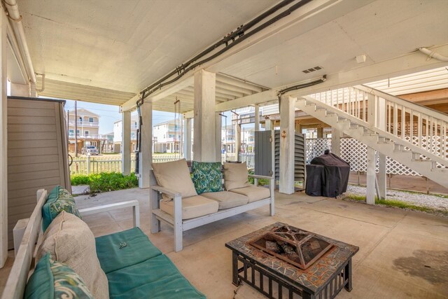 123 Howard Ave, Surfside Beach, TX 77541 - view of patio / terrace featuring stairs and an outdoor living space with a fire pit