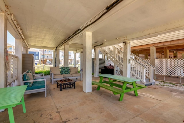 123 Howard Ave, Surfside Beach, TX 77541 - view of patio / terrace featuring an outdoor living space with a fire pit and stairway