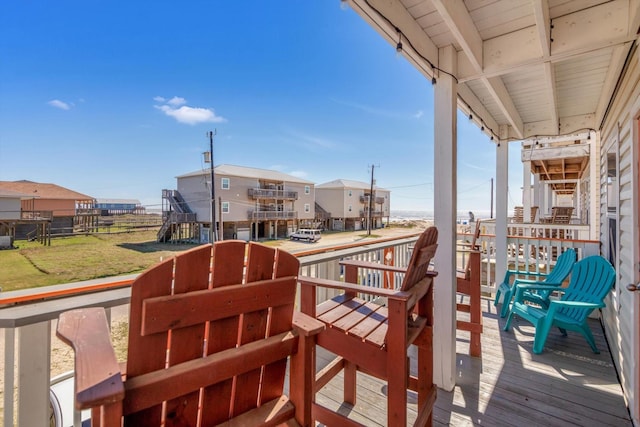 123 Howard Ave, Surfside Beach, TX 77541 - view of wooden balcony featuring a wooden deck and a residential view