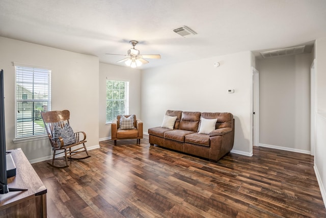 20918 Normandy Forest Dr, Spring, TX 77388 - living area with dark wood finished floors, plenty of natural light, a ceiling fan, and baseboards