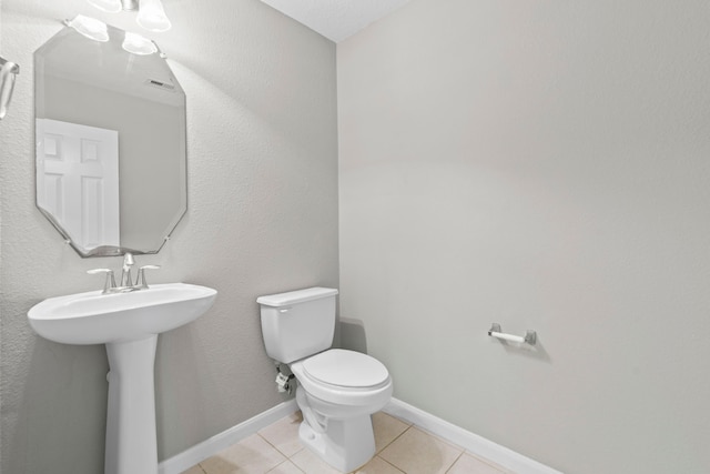 16606 Burnell Oaks Ln, Houston, TX 77090 - bathroom featuring toilet and tile patterned flooring