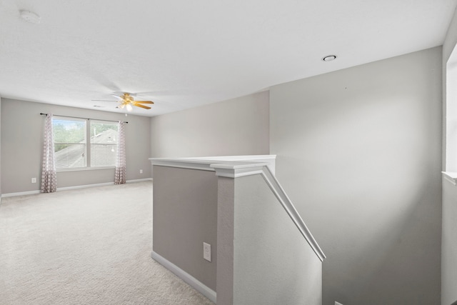 16606 Burnell Oaks Ln, Houston, TX 77090 - corridor with an upstairs landing, baseboards, and light colored carpet