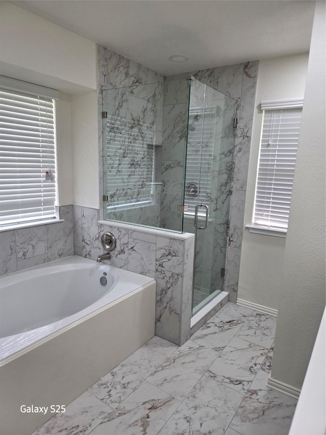 16111 Aberdeen Forest Dr, Houston, TX 77095 - bathroom with a garden tub, marble look tile flooring, a marble finish shower, and baseboards