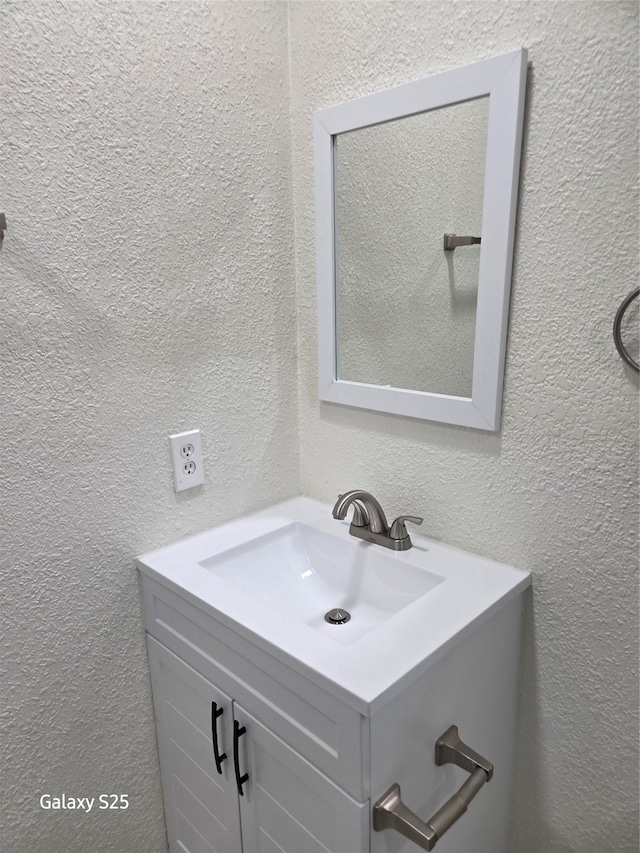 16111 Aberdeen Forest Dr, Houston, TX 77095 - bathroom featuring vanity and a textured wall