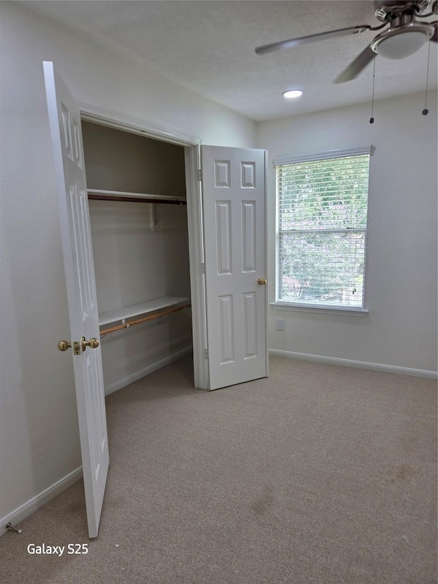 16111 Aberdeen Forest Dr, Houston, TX 77095 - unfurnished bedroom with carpet, baseboards, a closet, and ceiling fan