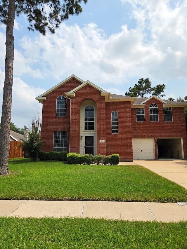 16111 Aberdeen Forest Dr, Houston, TX 77095 - view of front facade featuring an attached garage, driveway, and brick siding