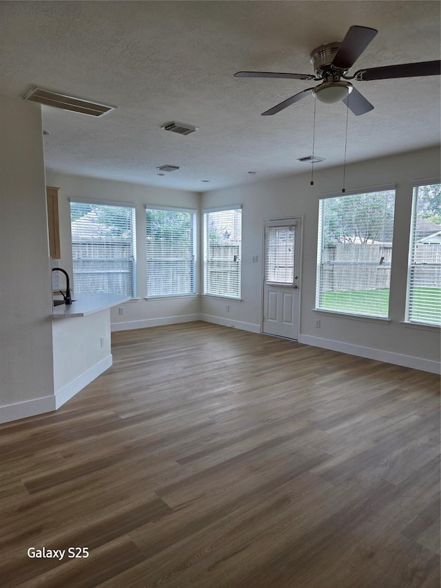 16111 Aberdeen Forest Dr, Houston, TX 77095 - unfurnished sunroom featuring a sink and healthy amount of natural light
