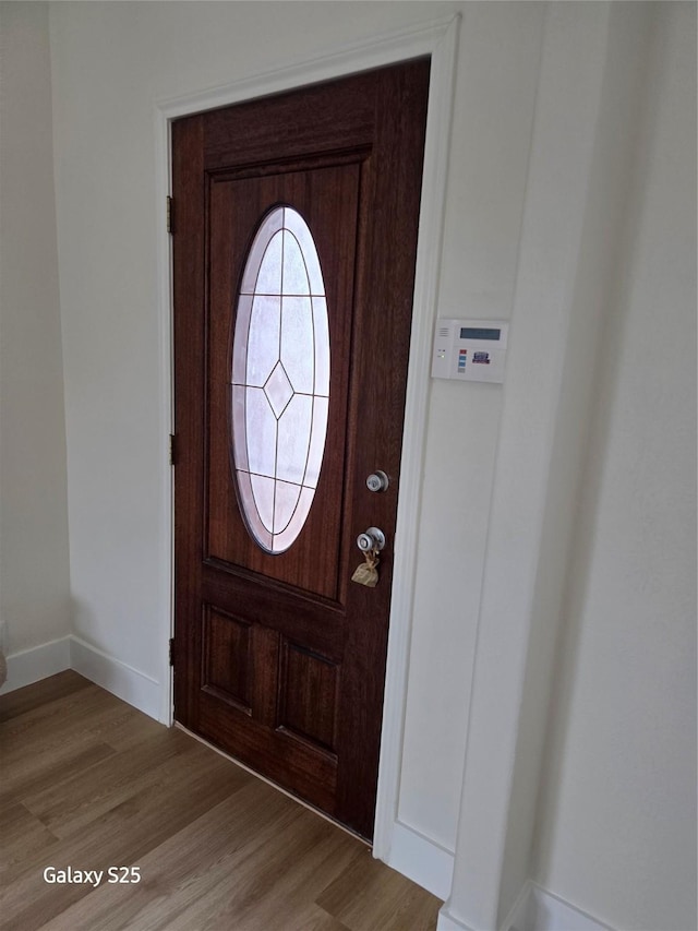 16111 Aberdeen Forest Dr, Houston, TX 77095 - entryway with light wood-style flooring and baseboards