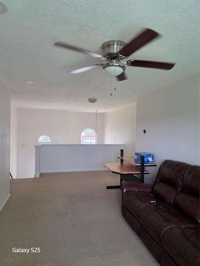 16111 Aberdeen Forest Dr, Houston, TX 77095 - carpeted living room featuring ceiling fan and a textured ceiling
